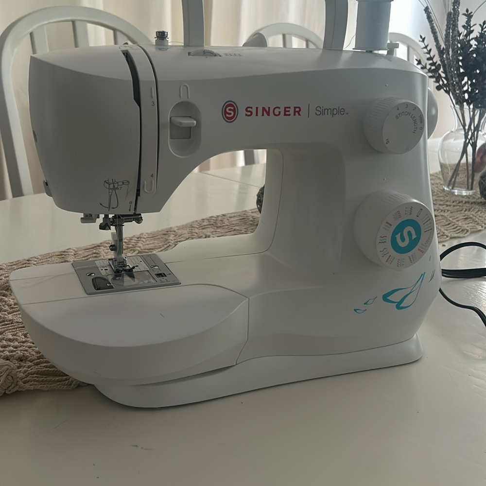 The singer simple sewing machine ! Used maybe twice. In excellent condition !